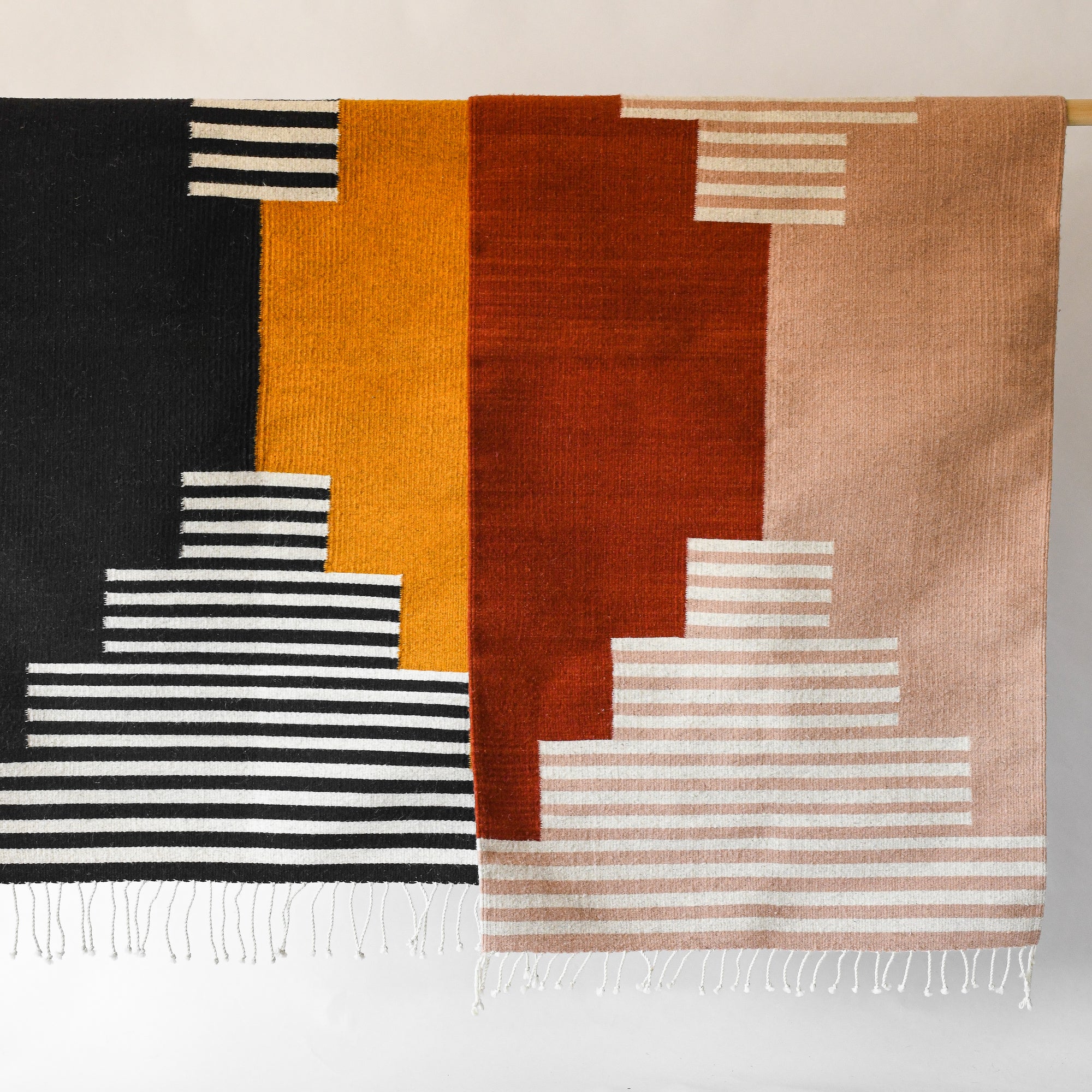 LOOM Imports handwoven ethical flat weave wool rugs. B Corp certified, women owned, fair trade, natural sustainable materials.