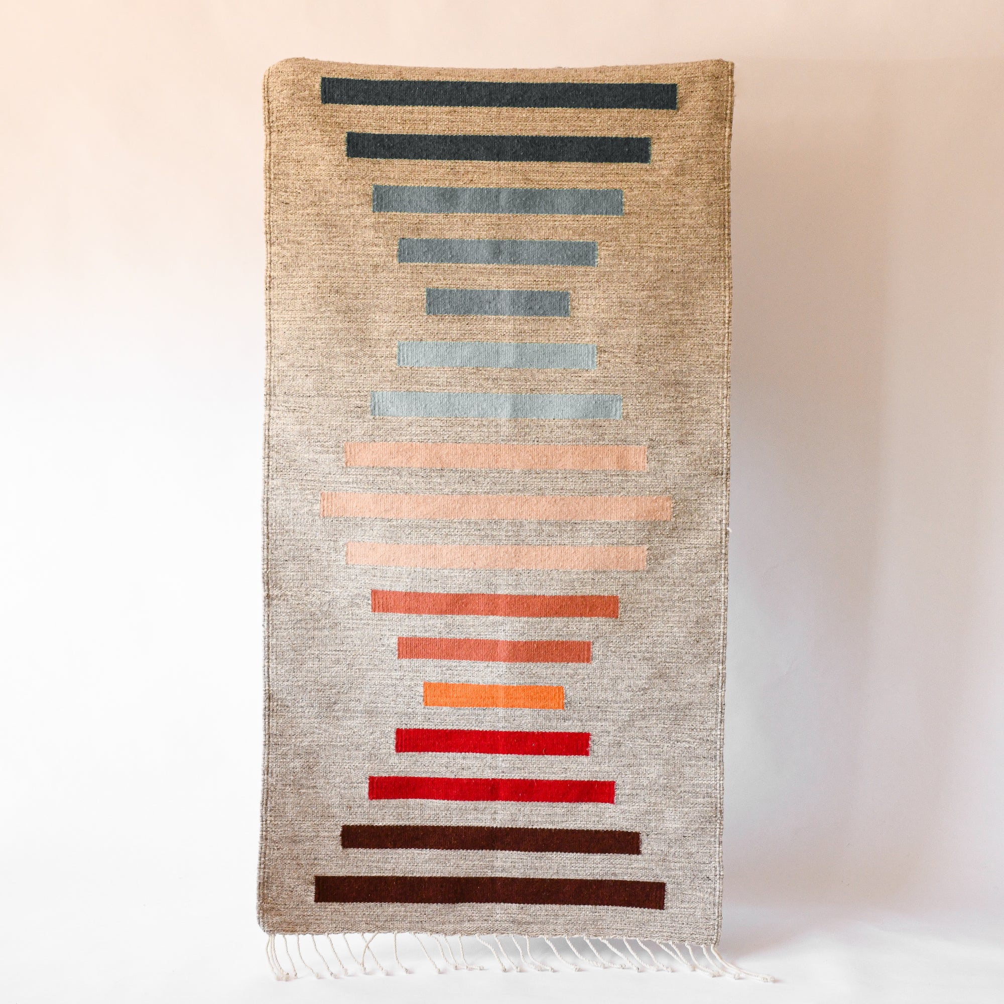 LOOM Imports handwoven ethical flat weave wool rugs. B Corp certified, women owned, fair trade, natural sustainable materials.