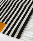 LOOM Imports handwoven ethical flat weave wool rugs. B Corp certified, women owned, fair trade, natural sustainable materials.