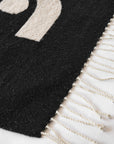 LOOM Imports handwoven ethical flat weave wool rugs. B Corp certified, women owned, fair trade, natural sustainable materials.