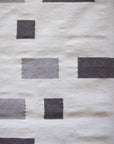 LOOM Imports handwoven ethical flat weave wool rugs. B Corp certified, women owned, fair trade, natural sustainable materials.