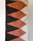 LOOM Imports handwoven ethical flat weave wool rugs. B Corp certified, women owned, fair trade, natural sustainable materials.