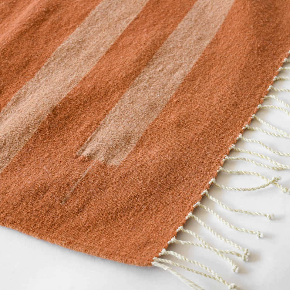 LOOM Imports handwoven ethical flat weave wool rugs. B Corp certified, women owned, fair trade, natural sustainable materials.