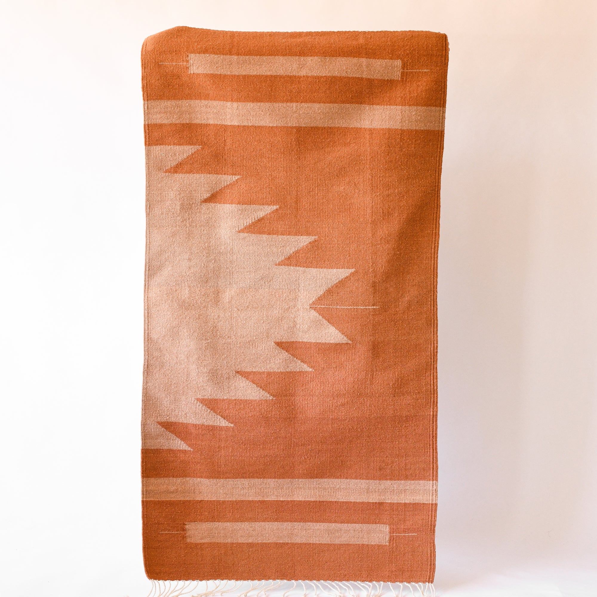 LOOM Imports handwoven ethical flat weave wool rugs. B Corp certified, women owned, fair trade, natural sustainable materials.