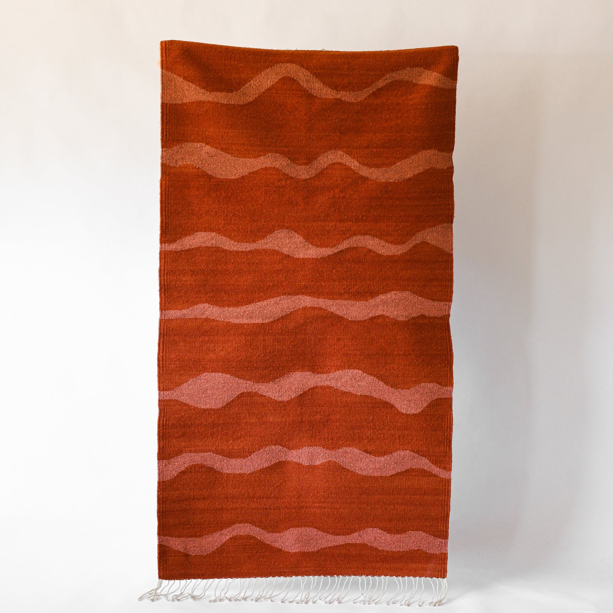LOOM Imports handwoven ethical flat weave wool rugs. B Corp certified, women owned, fair trade, natural sustainable materials.