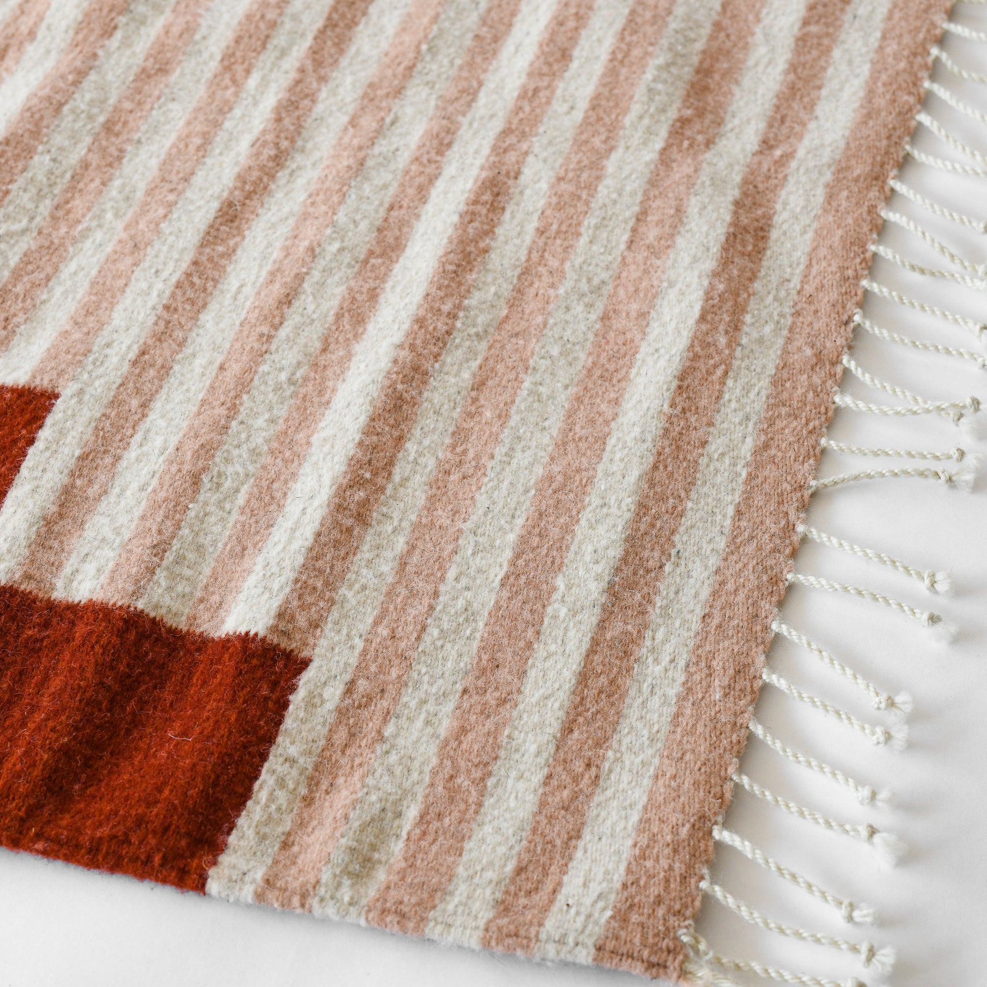 LOOM Imports handwoven ethical flat weave wool rugs. B Corp certified, women owned, fair trade, natural sustainable materials. 