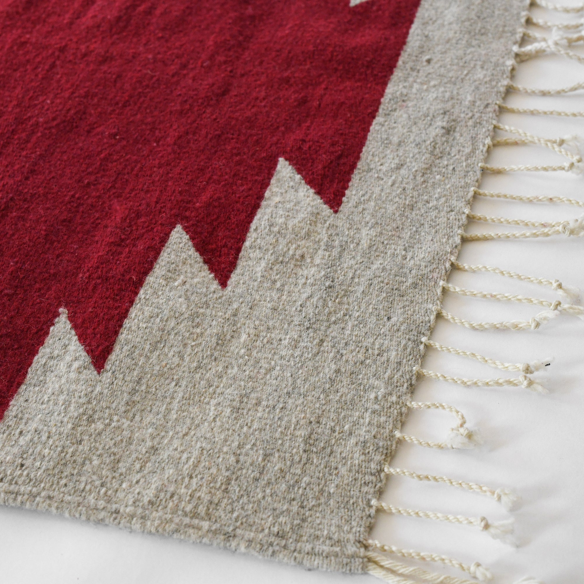 LOOM Imports handwoven ethical flat weave wool rugs. B Corp certified, women owned, fair trade, natural sustainable materials. 