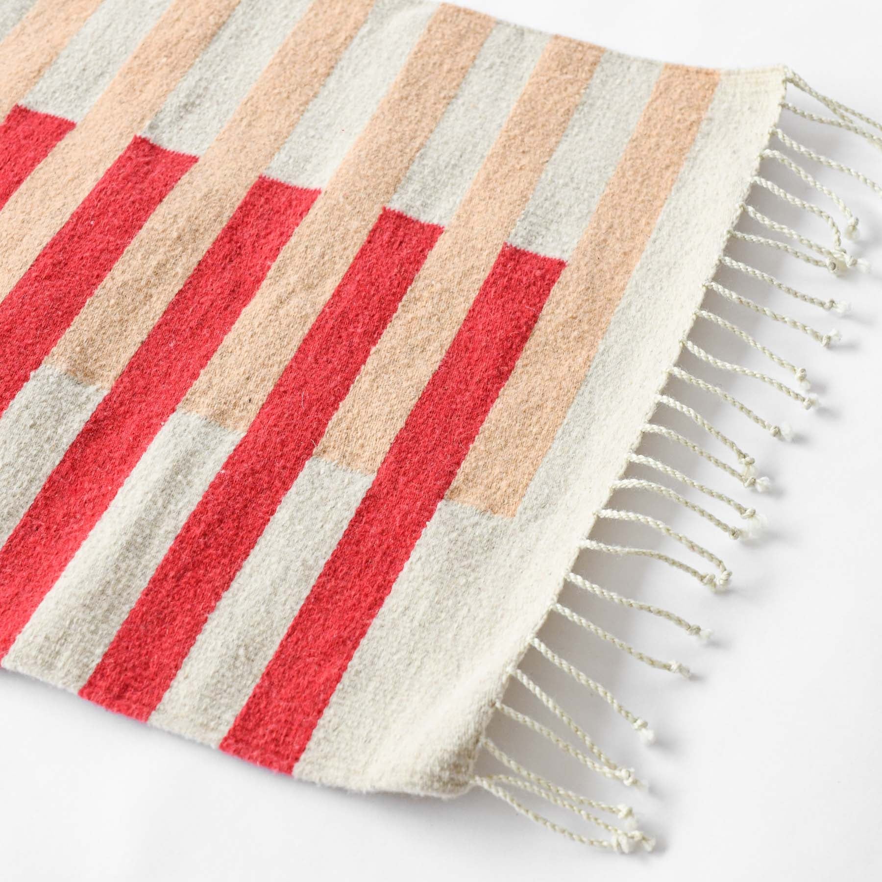 LOOM Imports handwoven ethical flat weave wool rugs. B Corp certified, women owned, fair trade, natural sustainable materials. 